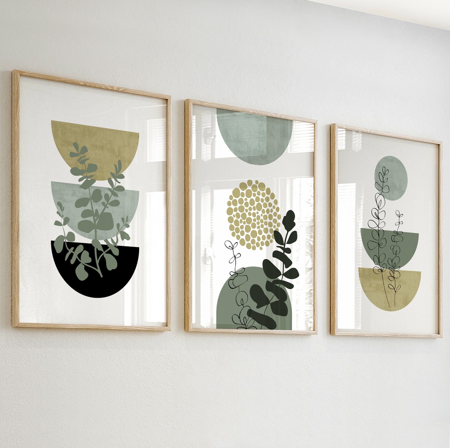 Abstract print with three stacked half-circle pots and botanical silhouettes in green, olive, and black tones.
