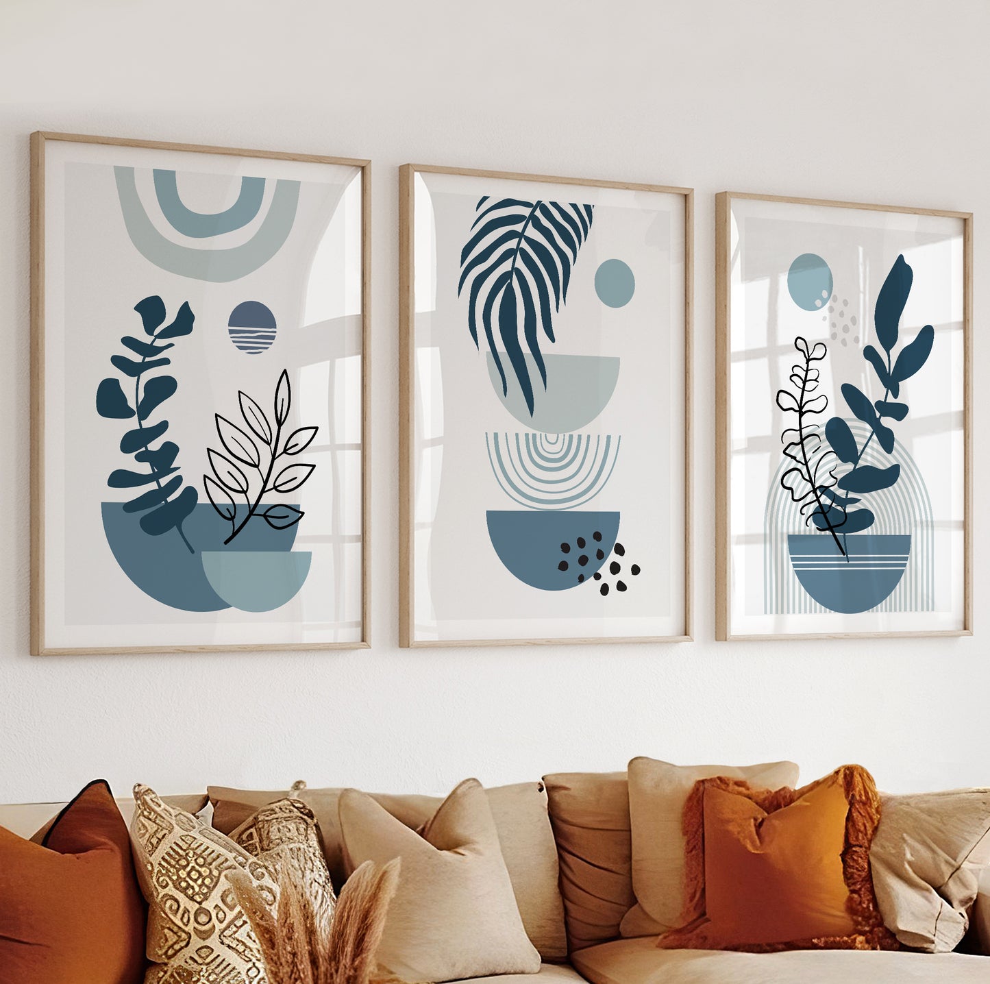 Stylized abstract plant with a hanging palm-like leaf over stacked semicircles in light blue tones.