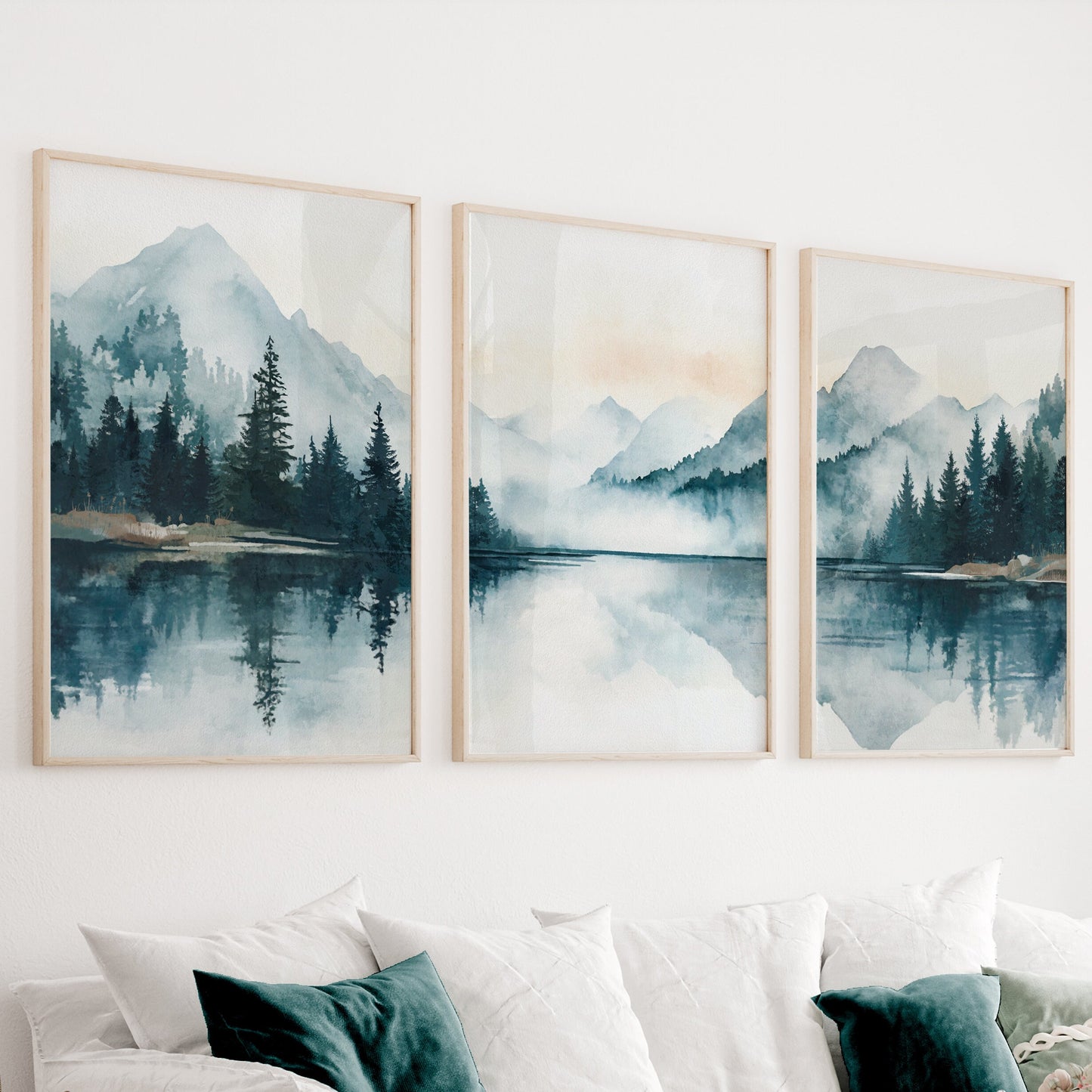 Set of 3 emerald green and blue mountain prints featuring lake surrounded by forest.