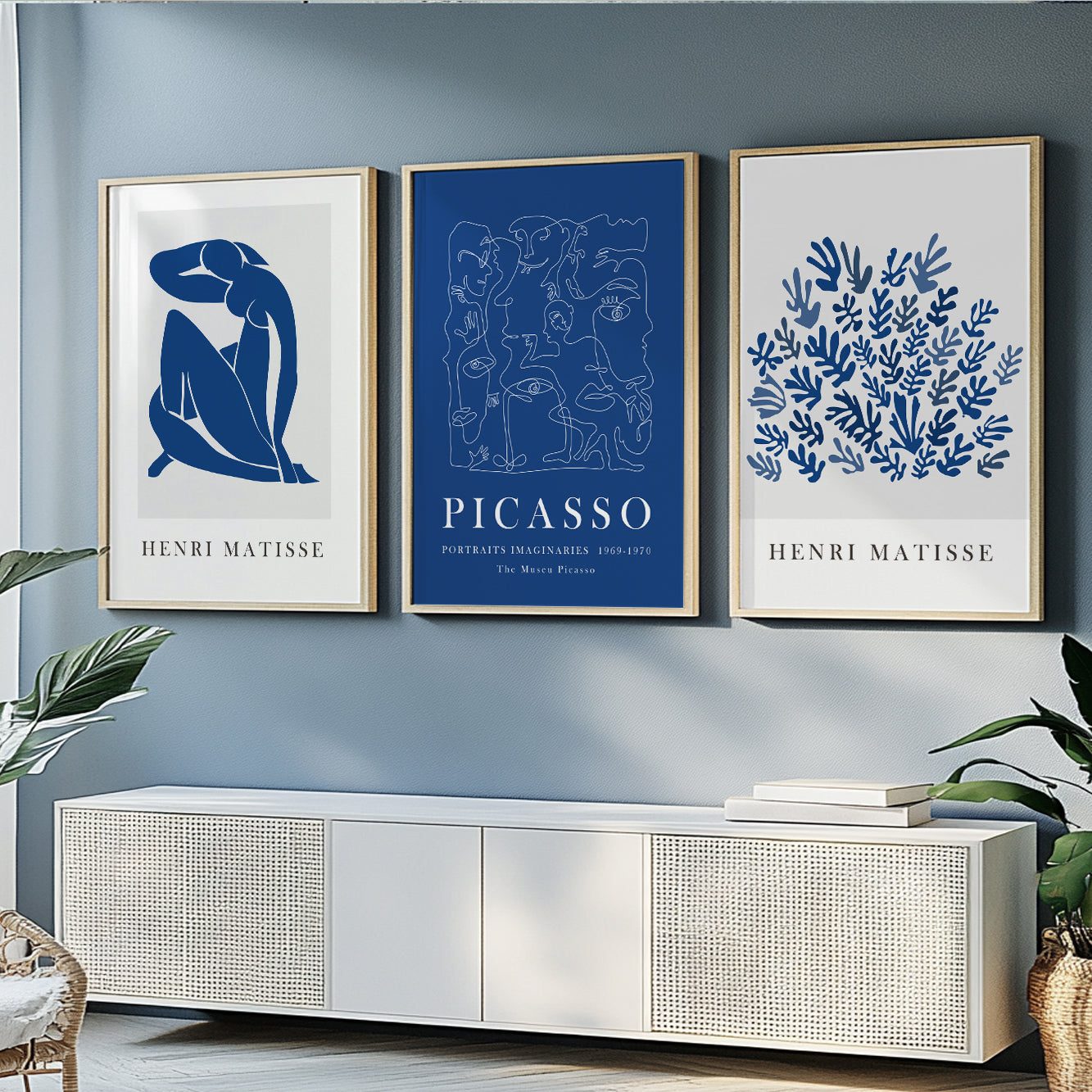 Modern mid-century gallery wall set with navy blue abstract prints inspired by Matisse.