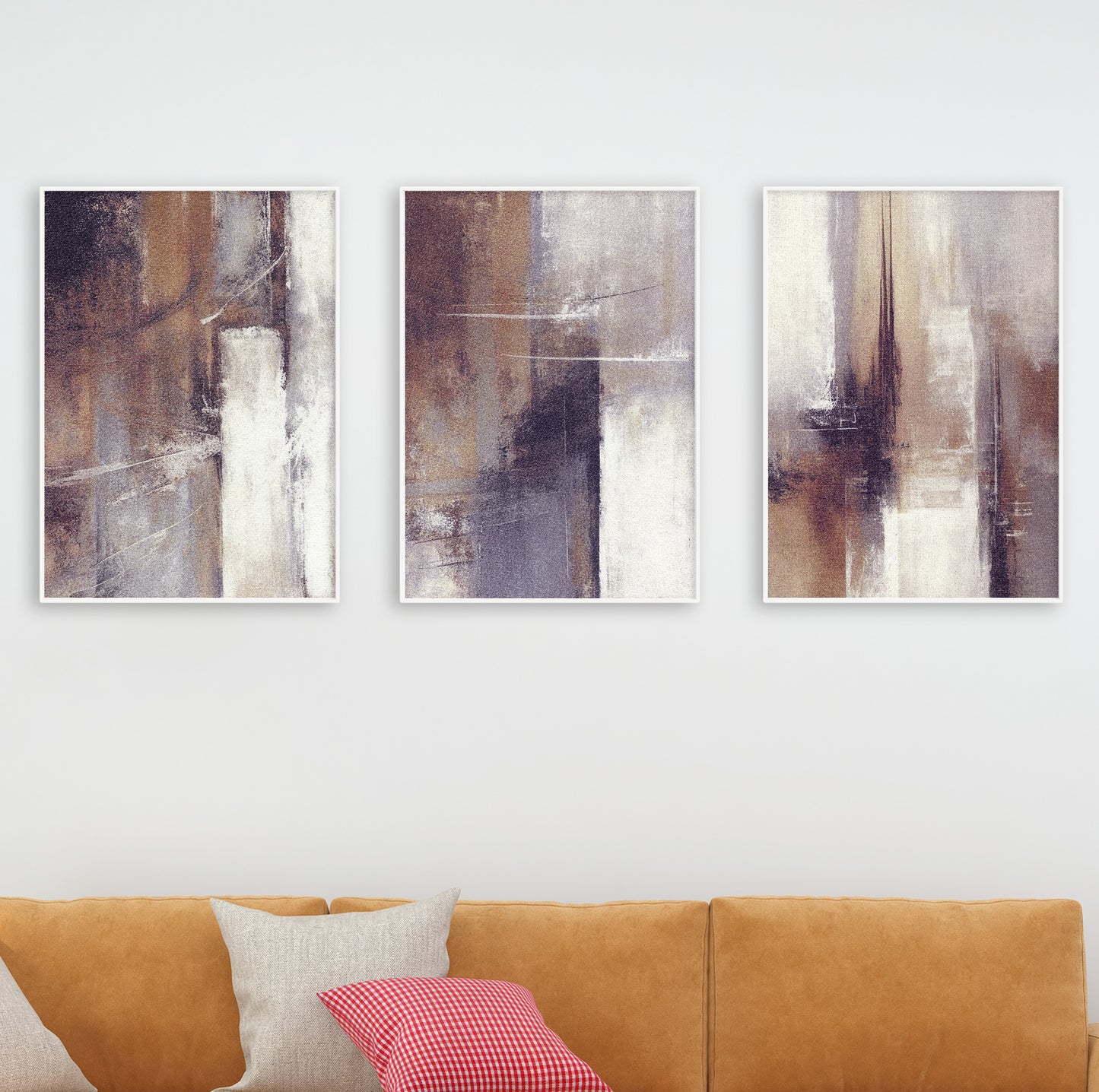 Interior design example showing abstract art trio in a clean space with soft lighting and wood frames.
