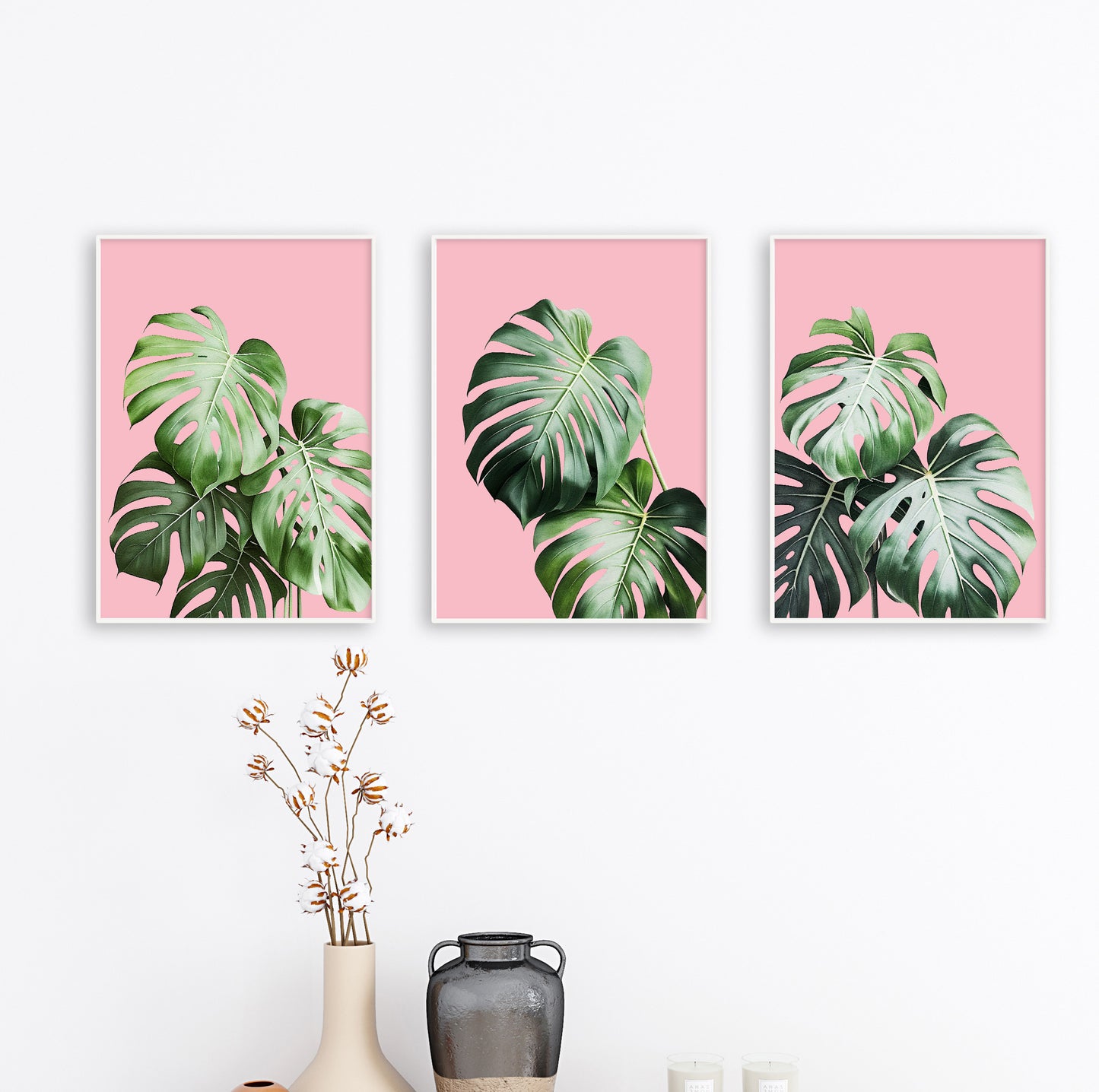 Minimalist botanical poster with monstera leaves contrasting beautifully with pink tones.