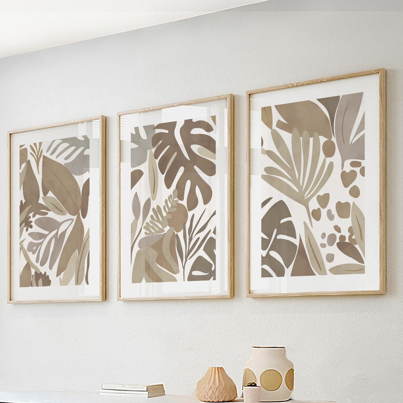 Set of 3 beige tropical prints – pastel botanical leaves wall art for mid-century modern interiors