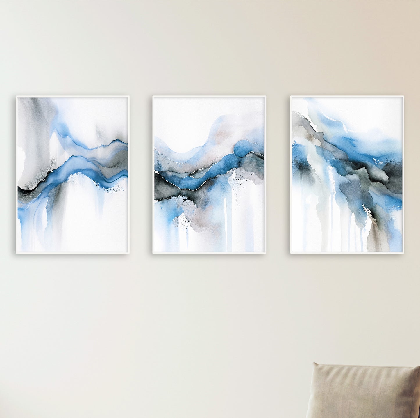 Aesthetic wall art prints with flowing ink patterns in soothing blue, white, and pale sand colors.