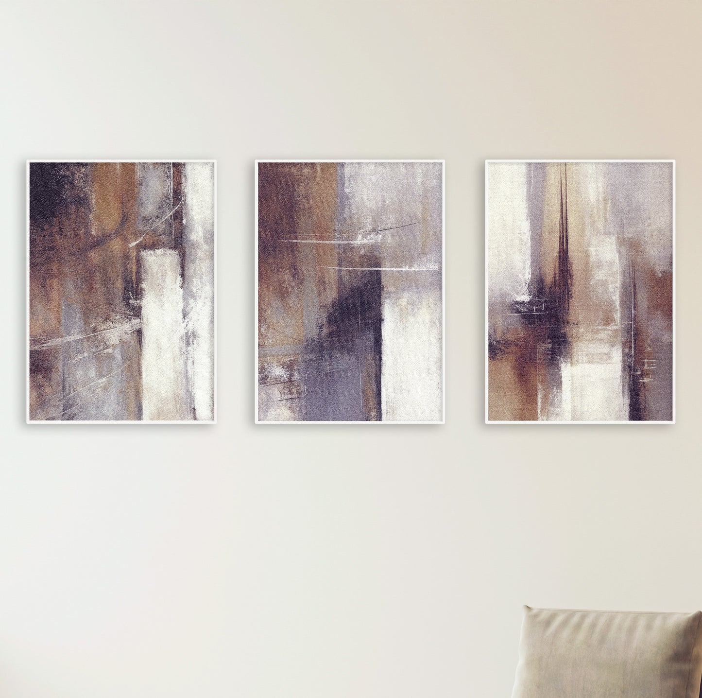 Three framed abstract posters displayed on a white wall featuring warm, soft, organic tones.