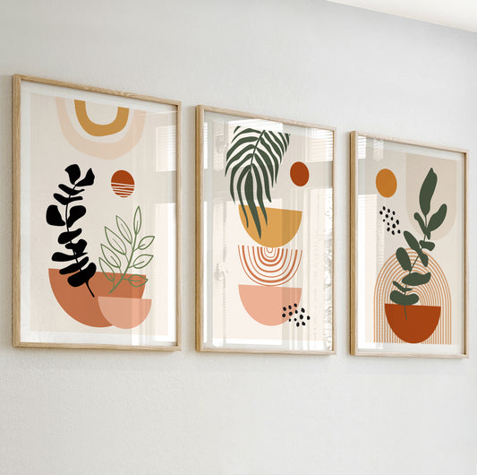 Minimalist abstract wall art with stylized black and green leaves in terracotta and peach pots.

