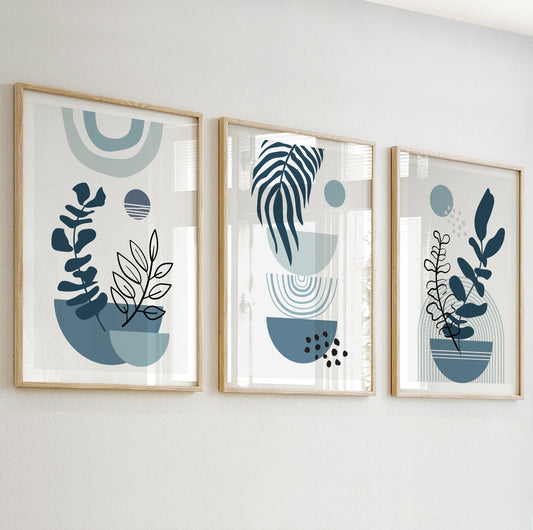 Abstract plant wall art with black and white botanical outlines in deep blue and soft teal vases.

