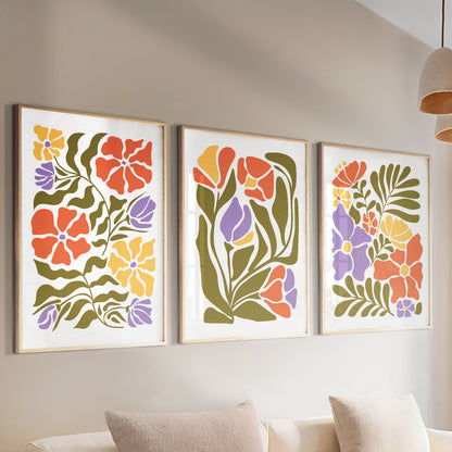 Set of three Matisse-style floral prints with light colorful minimalist botanical designs for mid-century gallery walls.