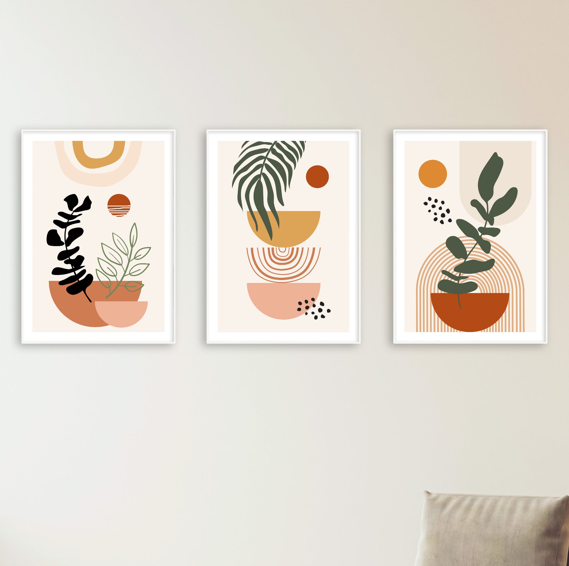 Set of three modern abstract posters featuring simplified plants and earthy shapes in a cohesive palette.

