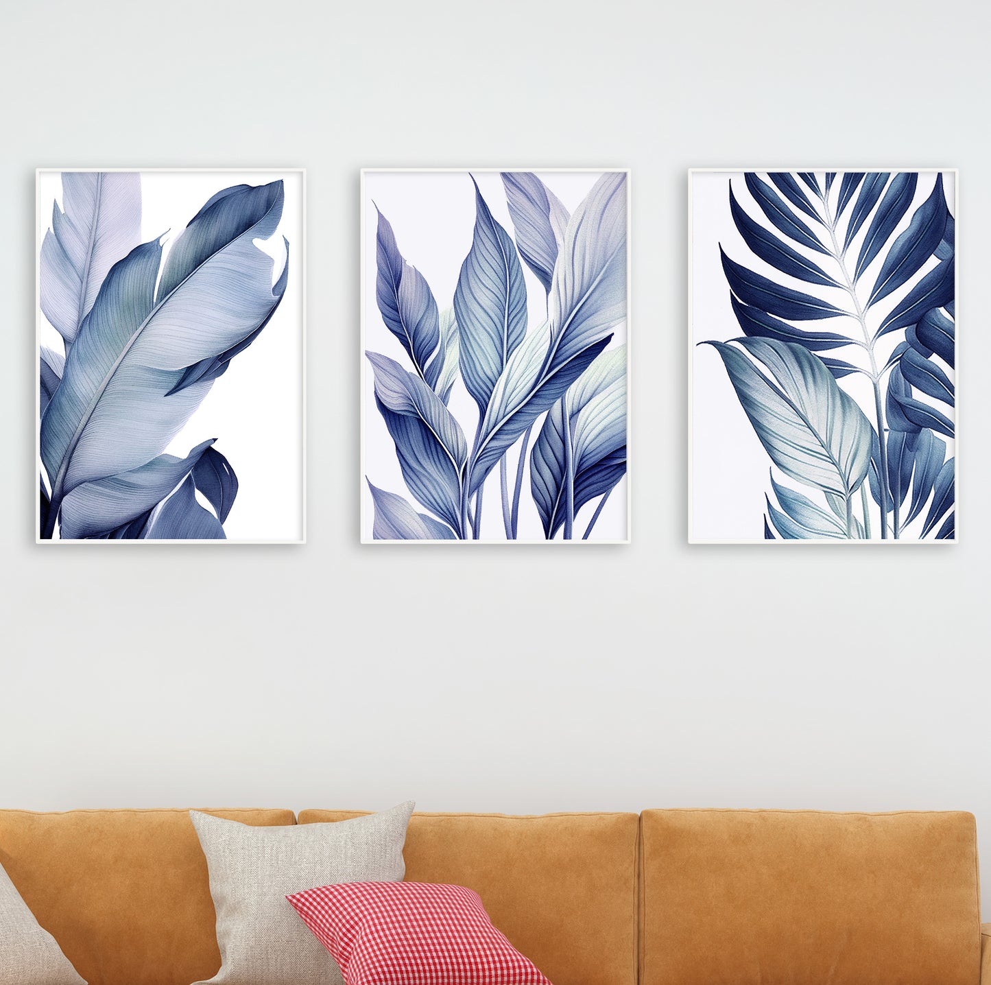 Scene showing framed blue botanical prints with a matte black lamp and wooden furniture in a modern living room.

