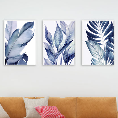 Scene showing framed blue botanical prints with a matte black lamp and wooden furniture in a modern living room.

