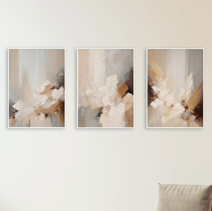 Three abstract prints with soft movement in a palette of beige, taupe, cream, and hints of burnt sienna.
