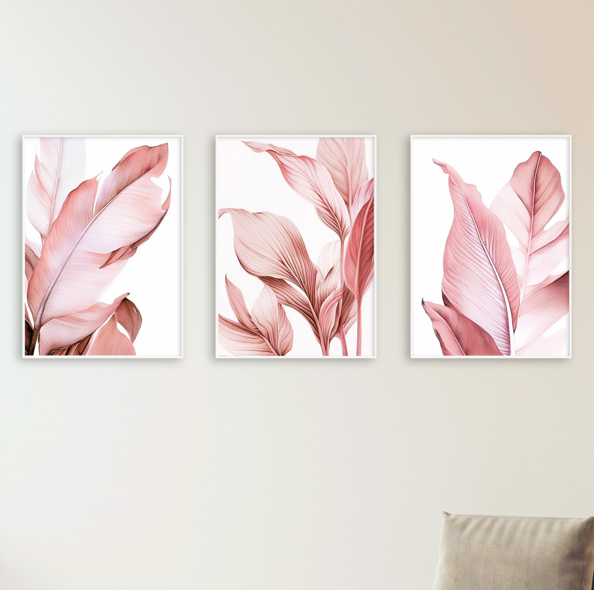 Serene bedroom interior featuring soft pink posters with leaves, white bedding, and natural accents.

